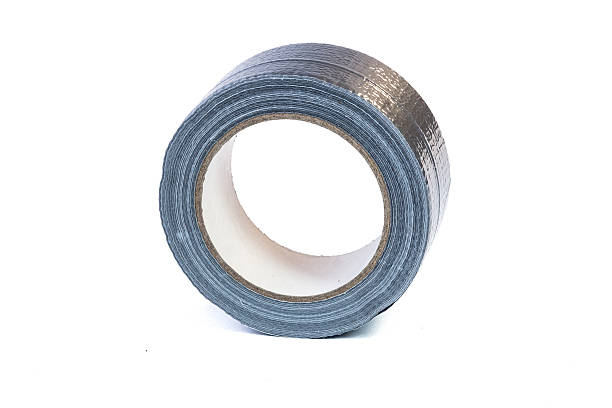 istock Duct tape roll silver repair reel isolated on white 627799224