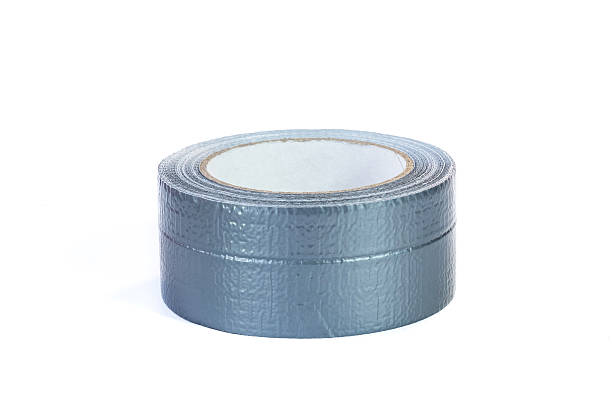 istock Duct tape roll silver repair reel isolated on white 627799246