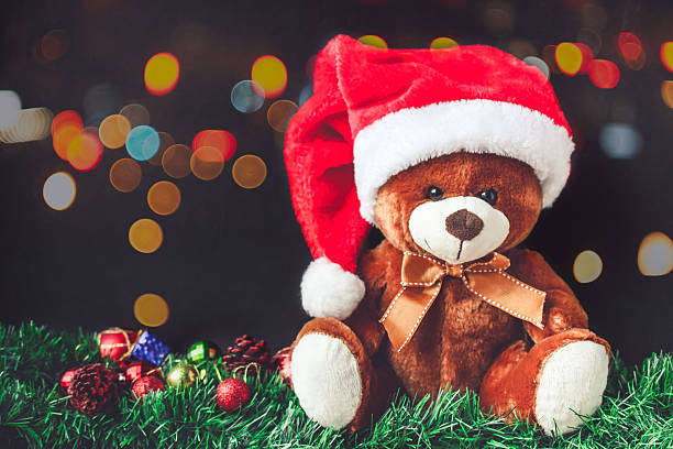 istock Teddy Bear and Santa  Hat in Christmas with Ball 627799732
