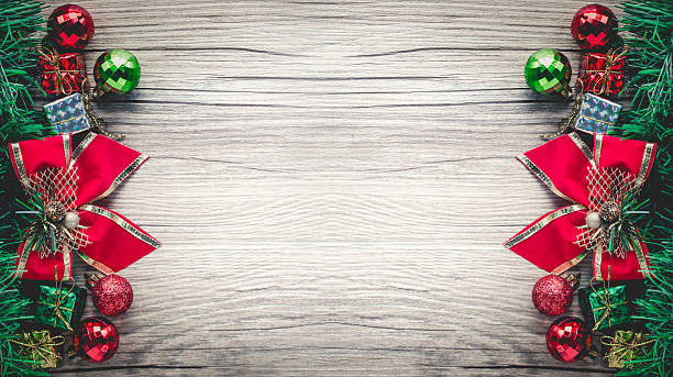 istock christmas gift boxes and balls background on wooden texture 627799894