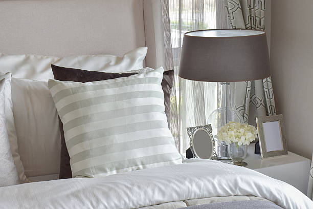 istock modern bedroom interior with green striped pillow on bed 627800388