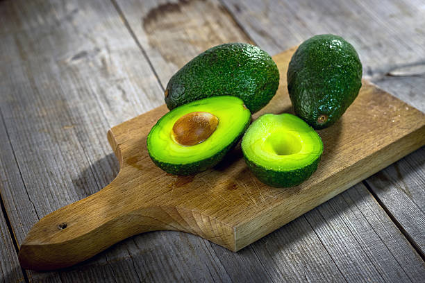 istock Avocado on  wooden background 627805936
