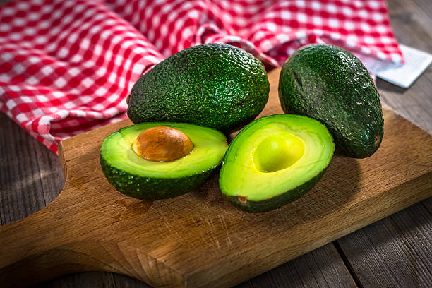 istock Avocado on  wooden background 627806014