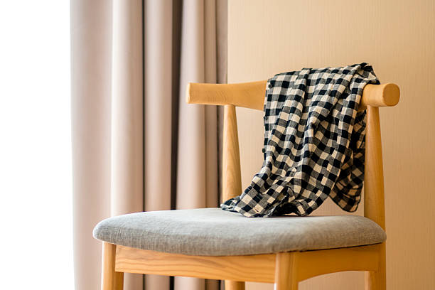 istock shirt on chair beside window 627806150