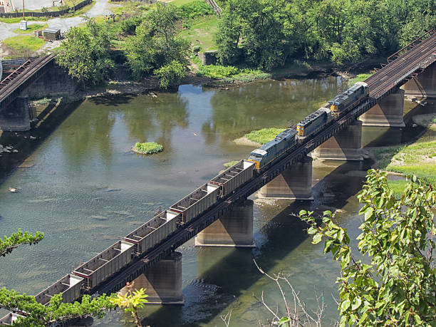 istock Empty coal cars crossing railroad bridge 627806204