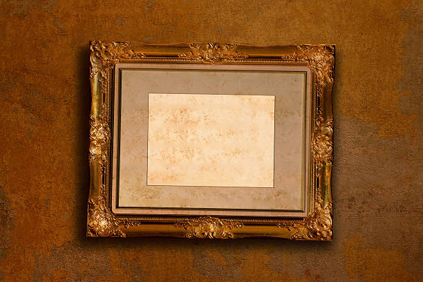 istock old gold antique picture frame on the dark wall 627806326