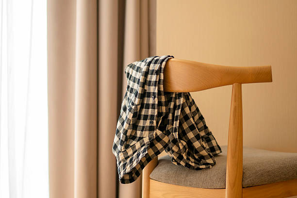 shirt on chair beside window