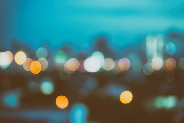 istock abstract background with bokeh defocused lights and shadow from cityscape 627811818