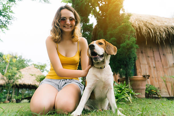istock Woman playing with dog 627812268