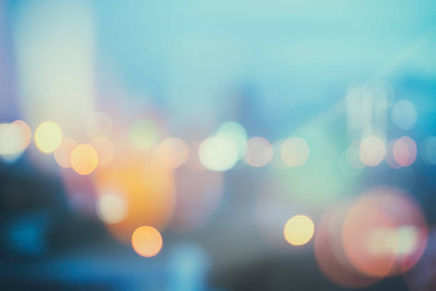 istock abstract background with bokeh defocused lights and shadow from cityscape 627813744