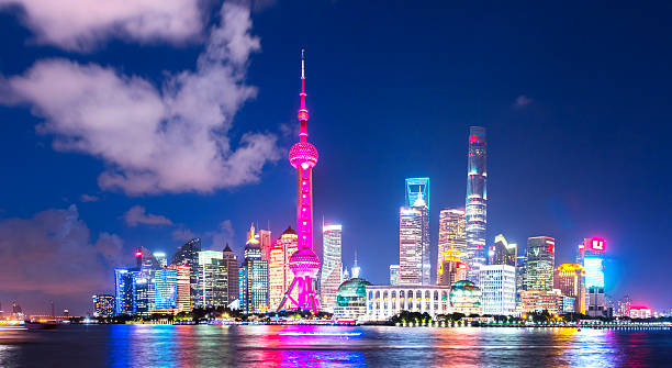 istock modern office buildings near illuminated orient pearl tower 627814720