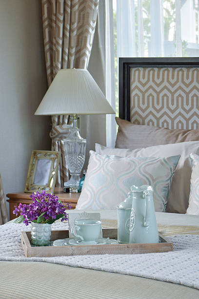 istock decorative wood tray of tea cup set on bed 627815128