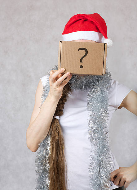 istock Young lady in Santas hat 627815890