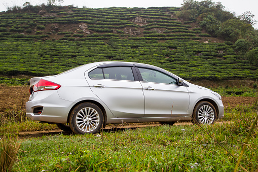 Hoabinh, Vietnam - Nov 15, 2016: Suzuki Ciaz sedan car is running on the mountain road in test drive in Vietnam.