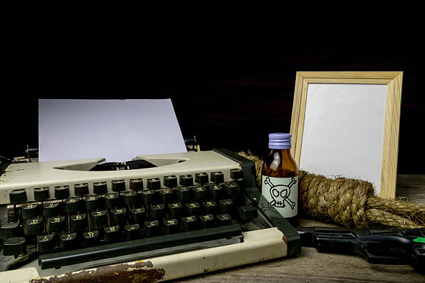 istock Typewriter with paper page and poison and gun. 627832684