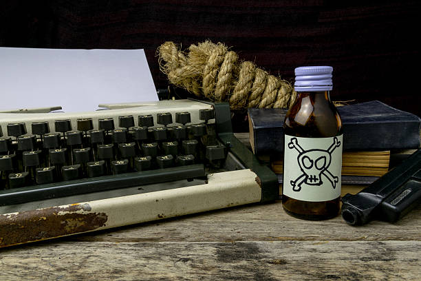 istock Typewriter with paper page and poison and gun. 627832690