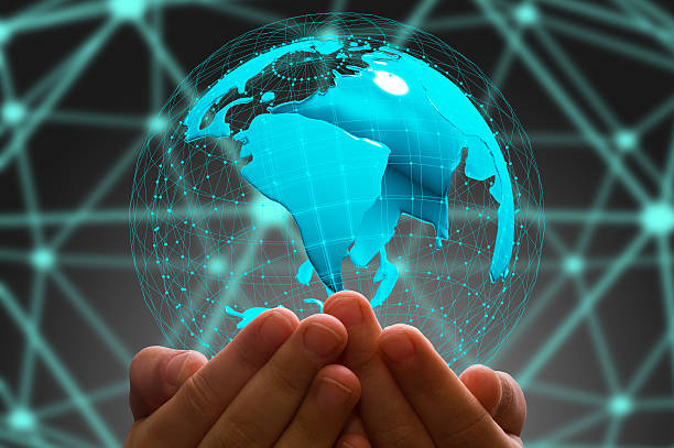 istock kid's hand holding  globe in  dark background 627838572