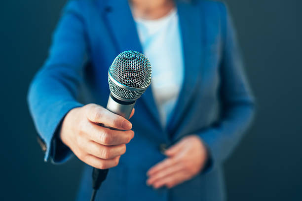 istock Elegant female journalist conducting business interview or press 627840014