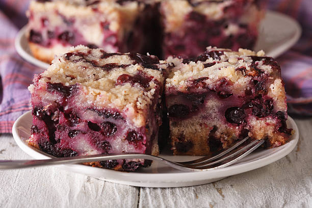 istock Sponge cake with blueberries close-up on a plate. horizontal 627840902