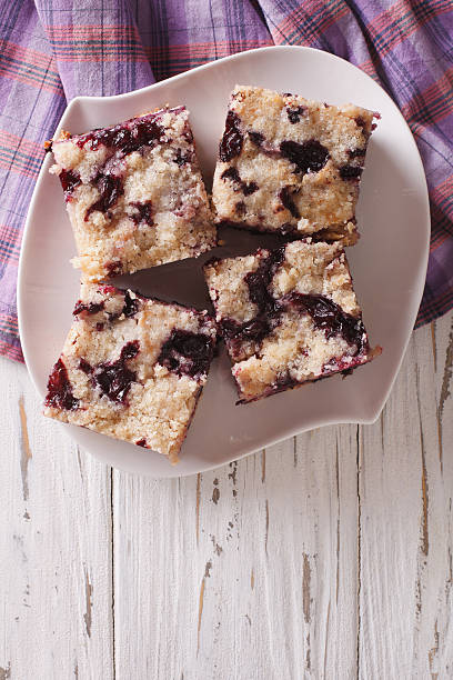 istock Berry pie with blueberries close-up. vertical top view 627841174
