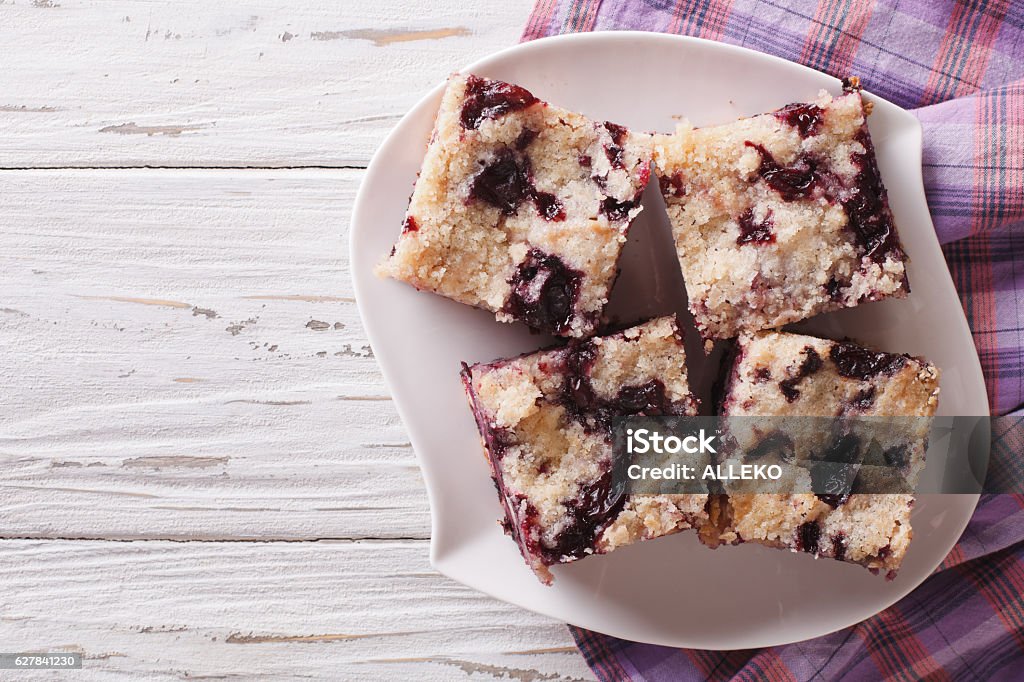 Berry pie with blueberries close-up. horizontal top view Berry pie with blueberries close-up on a plate on the table. horizontal view from above Blueberry Stock Photo