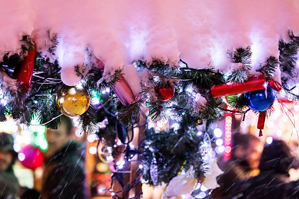 istock christmas street decorations on fir-branches covered with snow 627841666