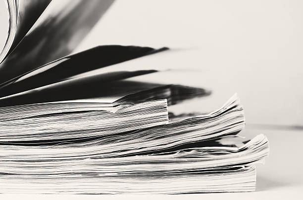 istock black and white image stack of magazines to turn pages 627851920