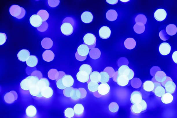 istock Blured purple and blue christmas light background 627852816