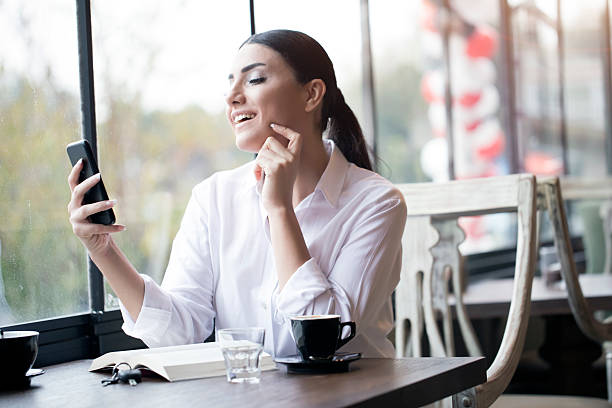 istock Businessoman Reading At Cafe 627854944