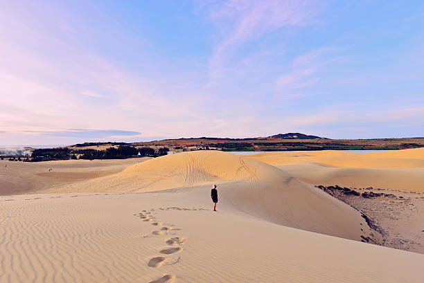 istock Tourist in white sand dunes 627856590