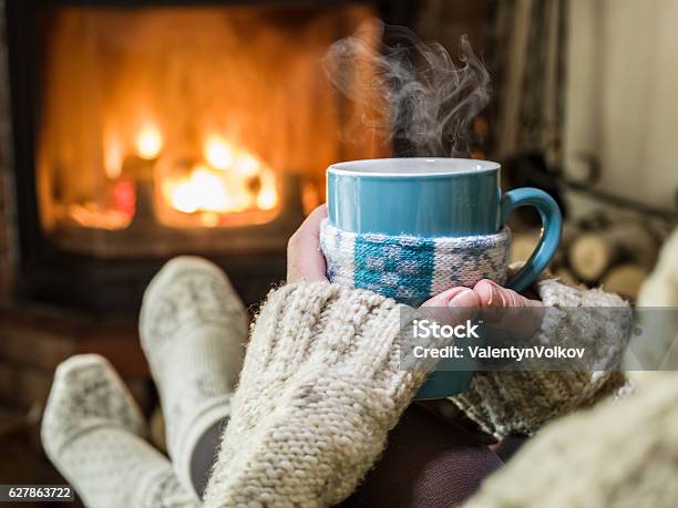 Warming And Relaxing Near Fireplace Stock Photo - Download Image Now - Heat - Temperature, Radiator - Heater, Coffee - Drink