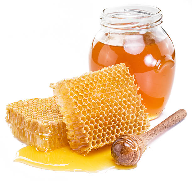 istock Jar full of fresh honey and honeycombs. 627864542