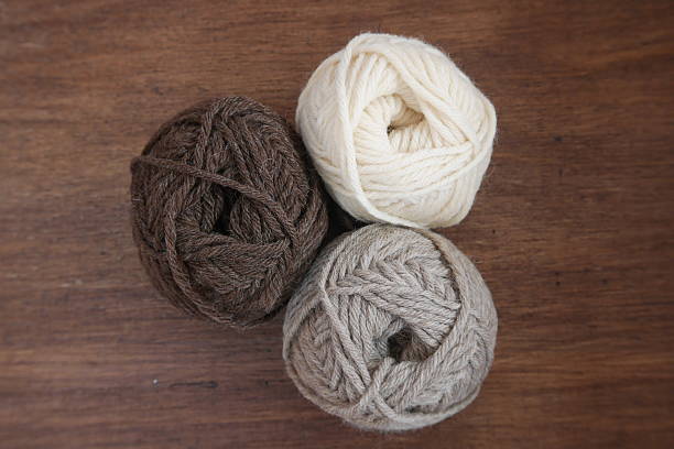 istock Brown, white and beige woolen balls 627870766