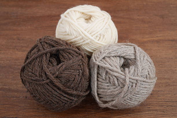 istock Brown, white and beige woolen balls 627870854