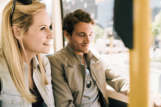 istock Thoughtful tourists sitting by window in bus 627871230