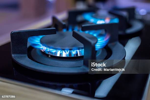 Stove Cook Stove Modern Kitchen Stove With Blue Flames Burning Stock Photo - Download Image Now