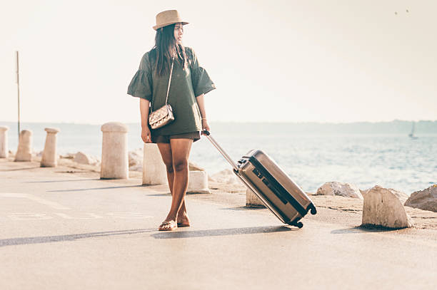 istock Thai Woman Tourist waiting for Transportation 627873302