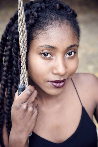 istock Beautiful black woman posing - close up 627886932