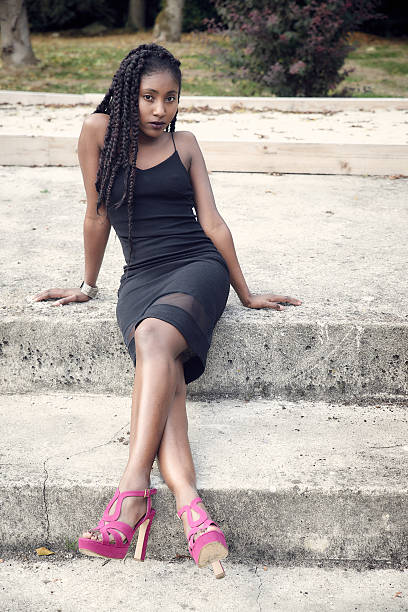 istock Beautiful black woman posing- stairs 627887392