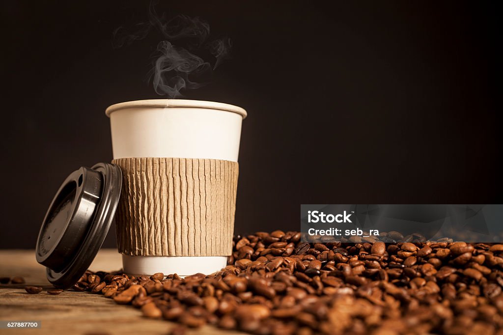 Paper cup of coffee on black background Coffee - Drink Stock Photo
