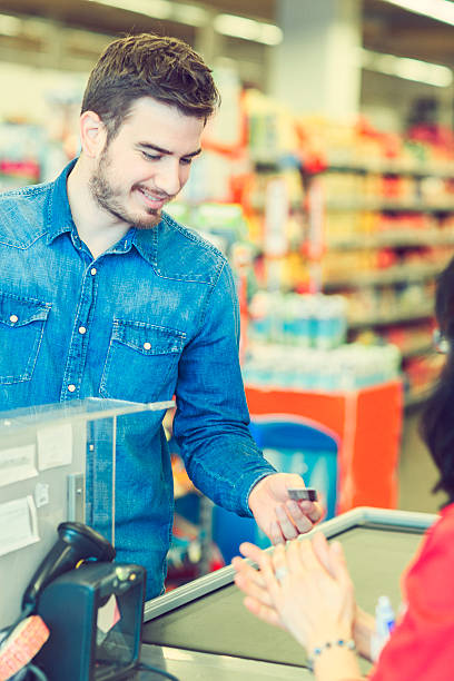 istock Young Man In Grocery Store 627890918
