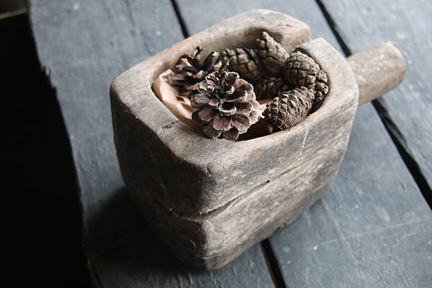 istock pine cone Christmas decoration on old rustic wooden table 627892994