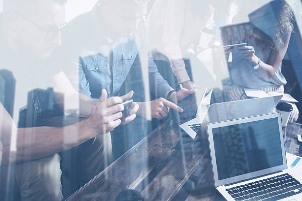 istock Young coworkers working together on creative startup project in modern 627893290