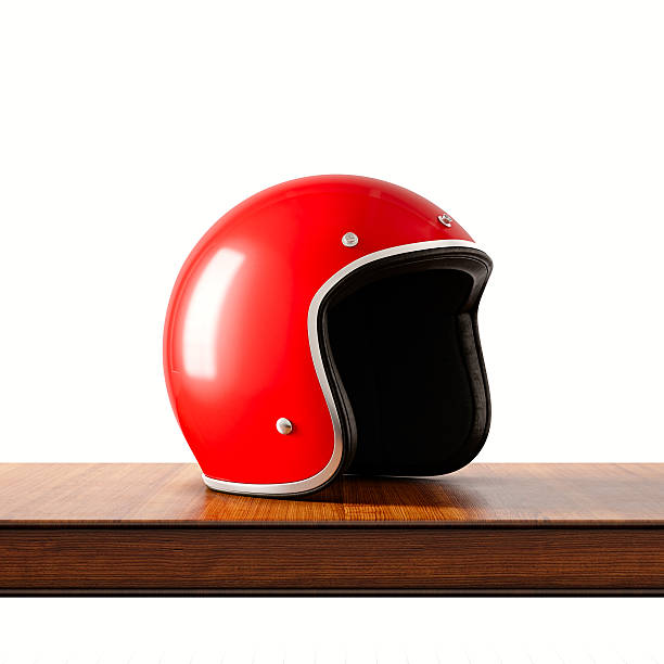 Side view of red color retro style motorcycle helmet on natural wooden desk.Concept classic object isolated white background.Square.3d rendering