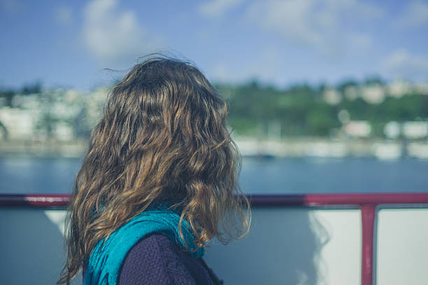 istock Young woman on boat 627904322