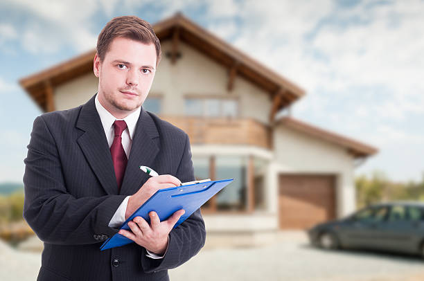 istock Professional estate seller with clipboard 627905146