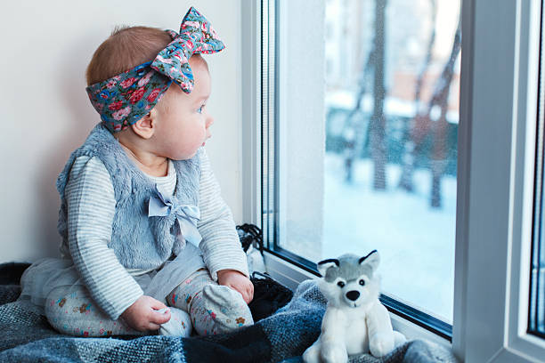 istock Child looks at snow 627906818