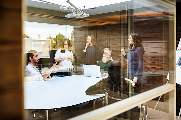 istock Corporate professionals meeting in conference room 627909584