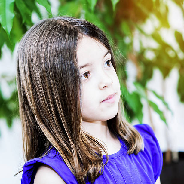 Portrait of cute girl concentrated Portrait of cute girl concentrated derange stock pictures, royalty-free photos & images