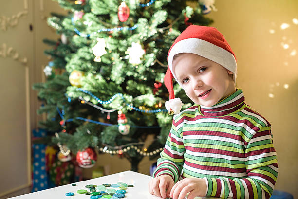 istock Kid child boy making by hands x-mas decorations 627916710